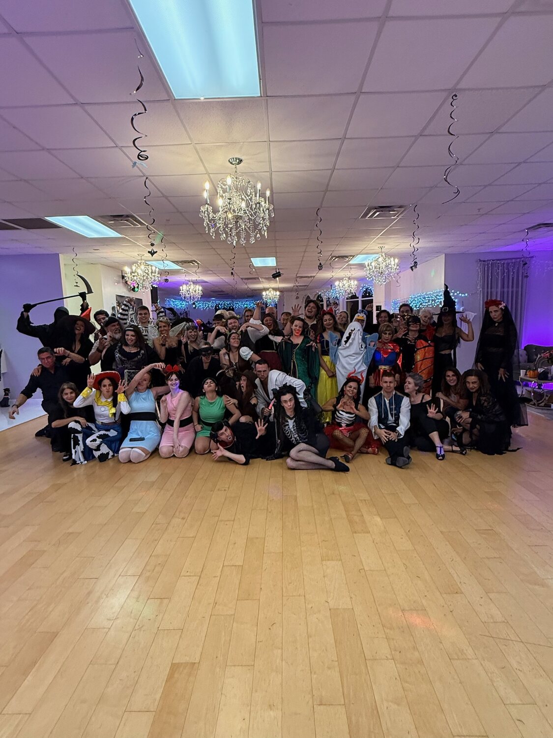 Fred Astaire Orlando students and instructors celebrating together in the studio